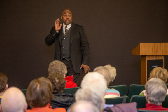 Greg Carr onstage as James Milton Turner