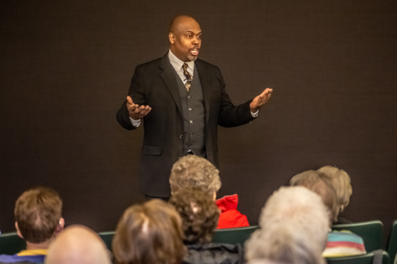 Greg Carr onstage as James Milton Turner