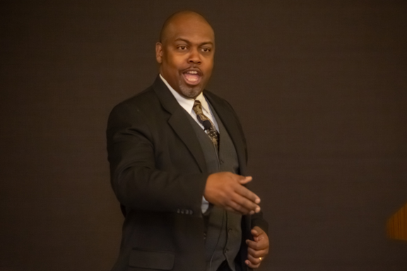 Greg Carr onstage as James Milton Turner
