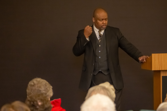 Greg Carr onstage as James Milton Turner